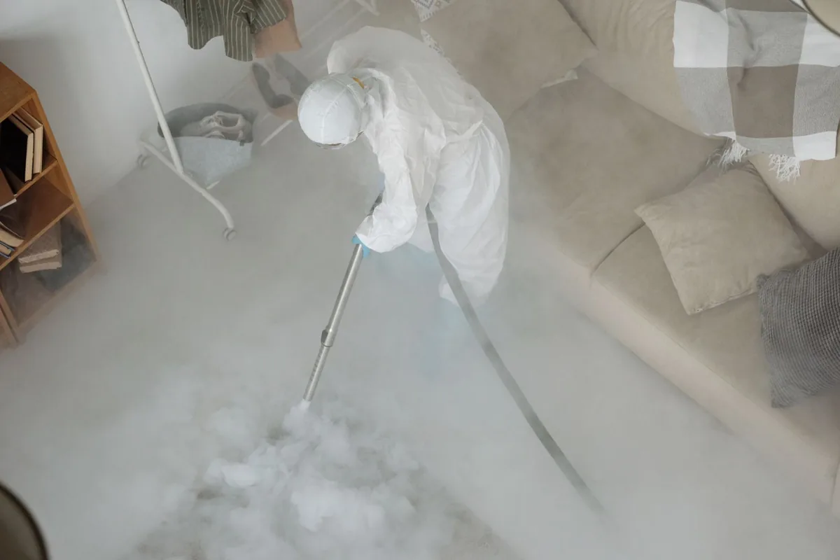 Biohazard cleanup technician in protective equipment, Bourbon, MO